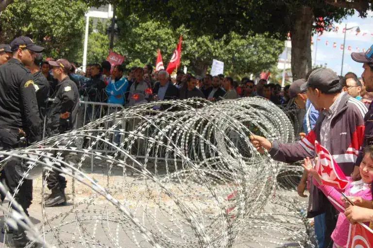 Tunisians Rally Amid Economic Crisis and Political Arrests