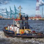 The Silent Guardians: Tugboat Crews Navigate the High-Traffic Waters of the Hudson Tall Ships Parade