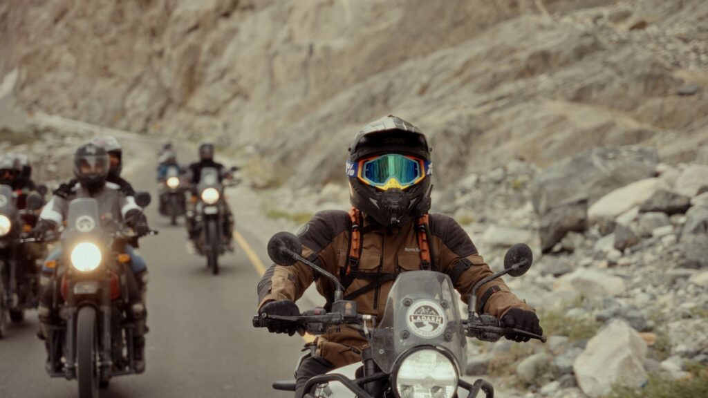 Group of motorcyclists on a daring adventure through rugged rocky roads.