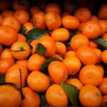 A vivid close-up of fresh, juicy oranges showcasing their vibrant color and freshness.