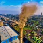 Aerial photograph showcasing air pollution from a factory in Jakarta, Indonesia.