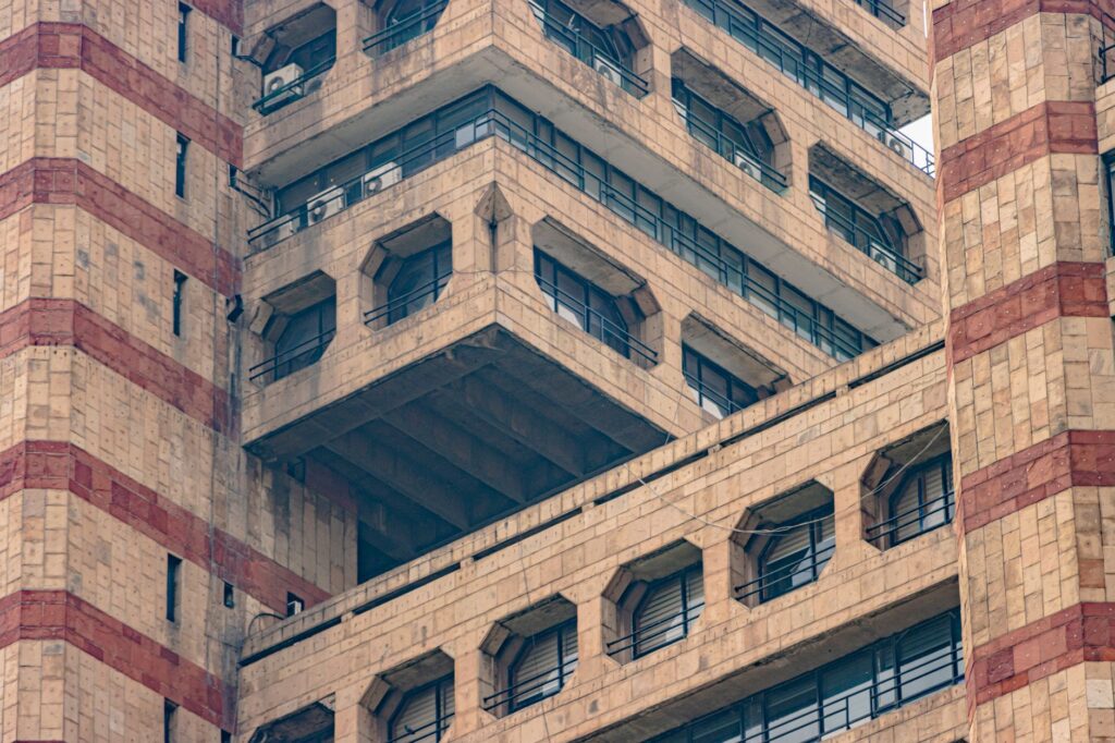 Close-up of brutalist architecture featuring geometric patterns in New Delhi, India.