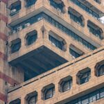 Close-up of brutalist architecture featuring geometric patterns in New Delhi, India.