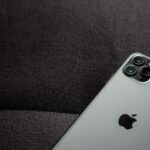 Close-up of a smartphone highlighting its modern design on a dark background.