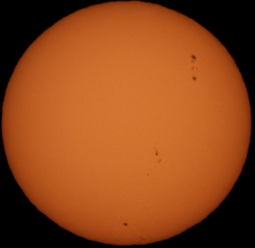 Detailed photo of the Sun showing sunspots, ideal for science or astronomy content.