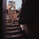 A view of a destroyed staircase amid rubble from a collapsed building in Ibadan, Nigeria.