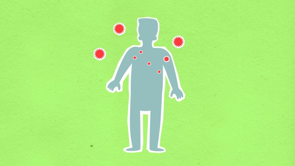 Paper cutout of male silhouette surrounded with many spreading contagious red viruses on green background during dangerous coronavirus disease outbreak