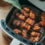 Delicious crispy chicken pieces cooked perfectly in a modern air fryer, ready to serve.
