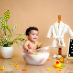 Celebrate an 8-month milestone with a cute baby enjoying a themed milk bath session.