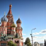Stunning view of St. Basil's Cathedral in Moscow under a clear summer sky.