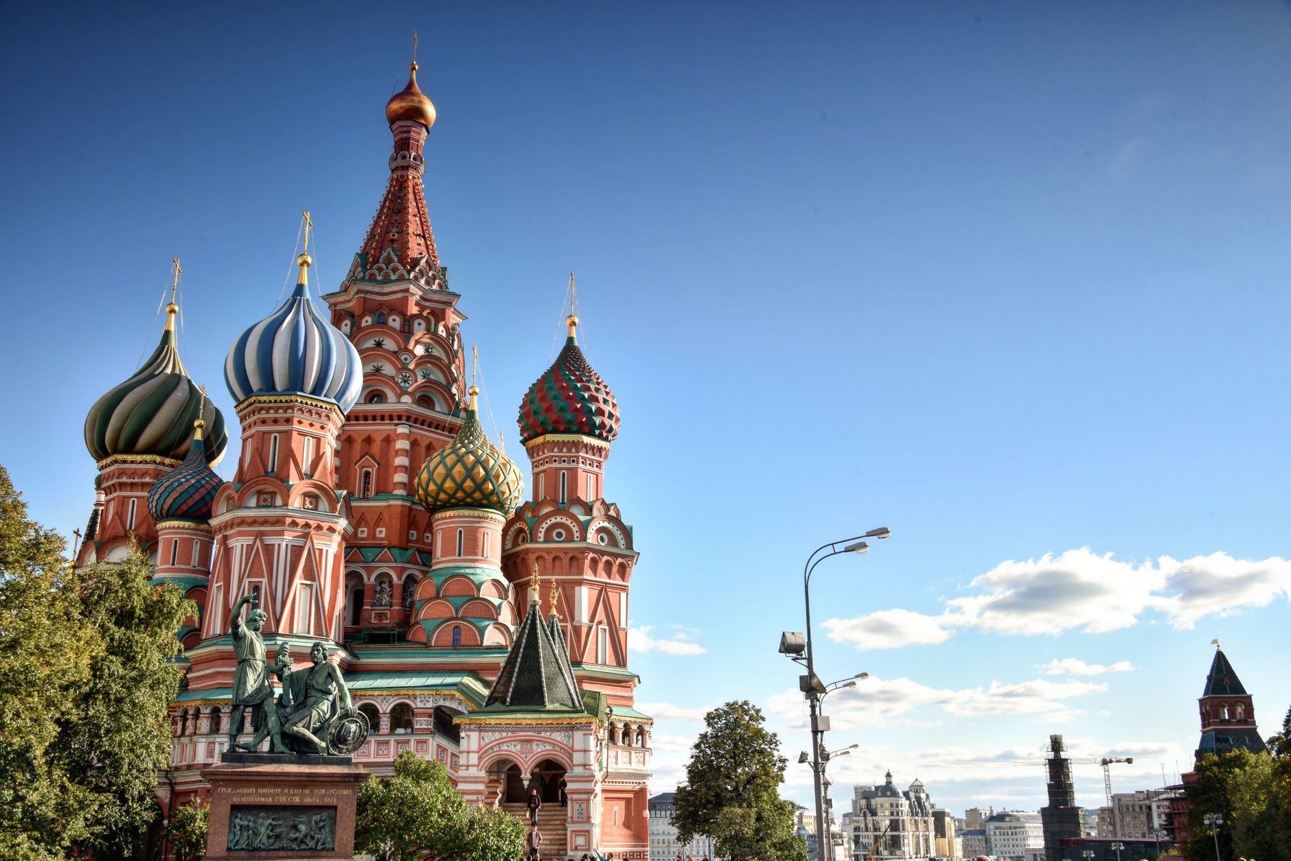 Stunning view of St. Basil's Cathedral in Moscow under a clear summer sky.