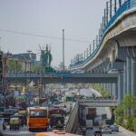 View of a busy road in Delhi featuring the Azadpur Flyover and local traffic.