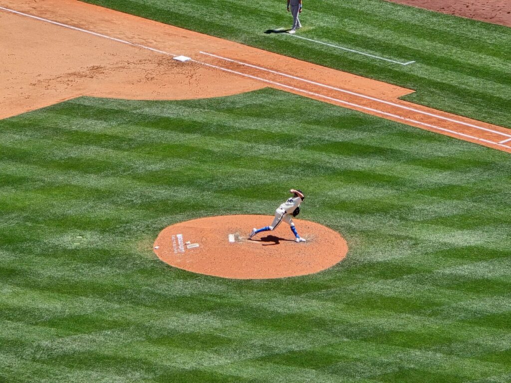 Dynamic shot of a baseball pitcher in action on a sunny day at Seattle stadium.