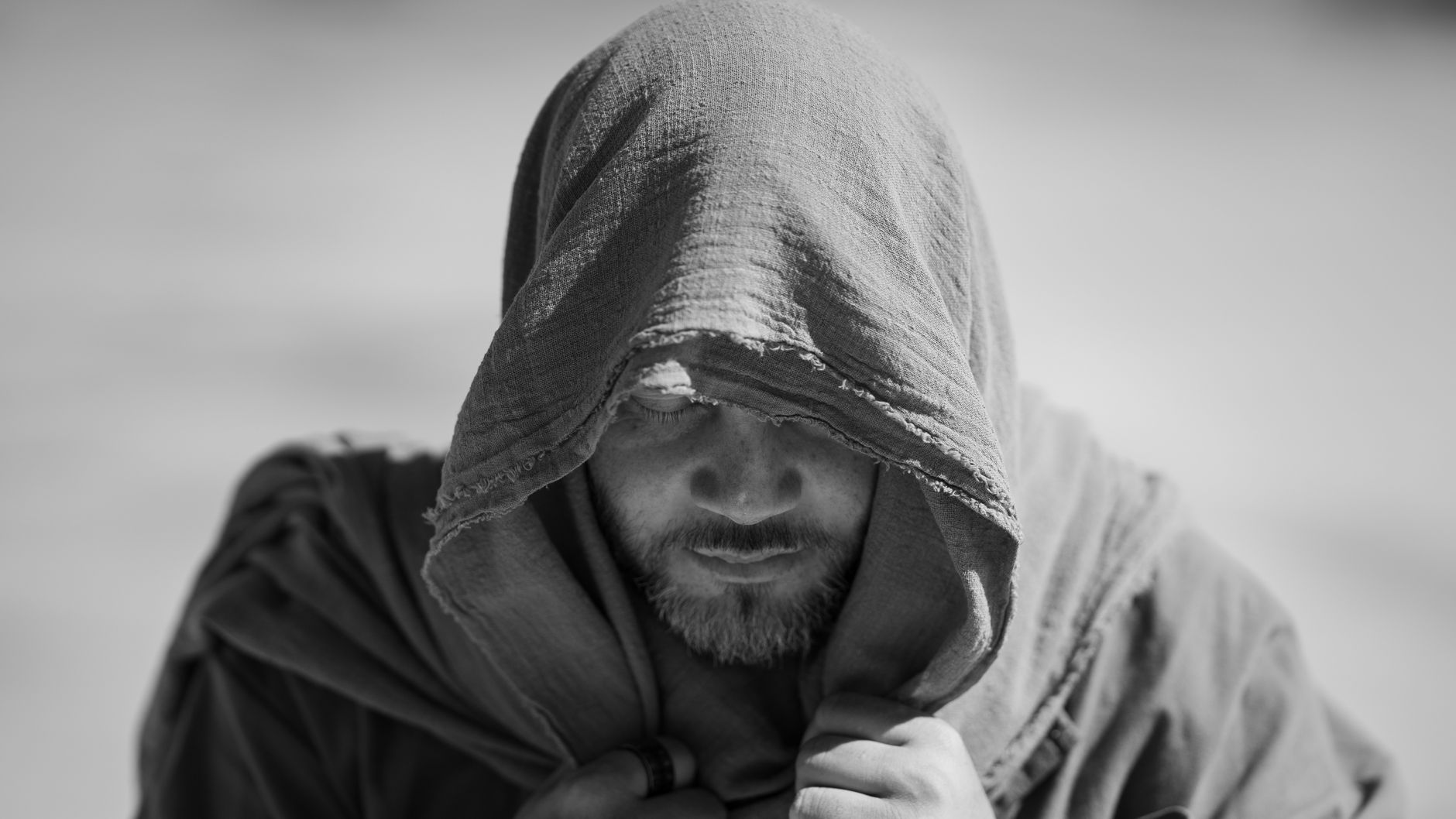 Black and white portrait of a contemplative man in a headscarf, New Port Richey.