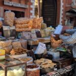 A bustling street food stall in Jaipur, showcasing a variety of traditional Indian snacks and a merchant.