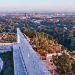 Stunning panoramic view from Getty Center featuring modern architecture and lush gardens against Los Angeles skyline.