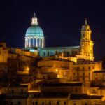 Spectacular night scene of Ragusa's illuminated cathedral with baroque architecture.
