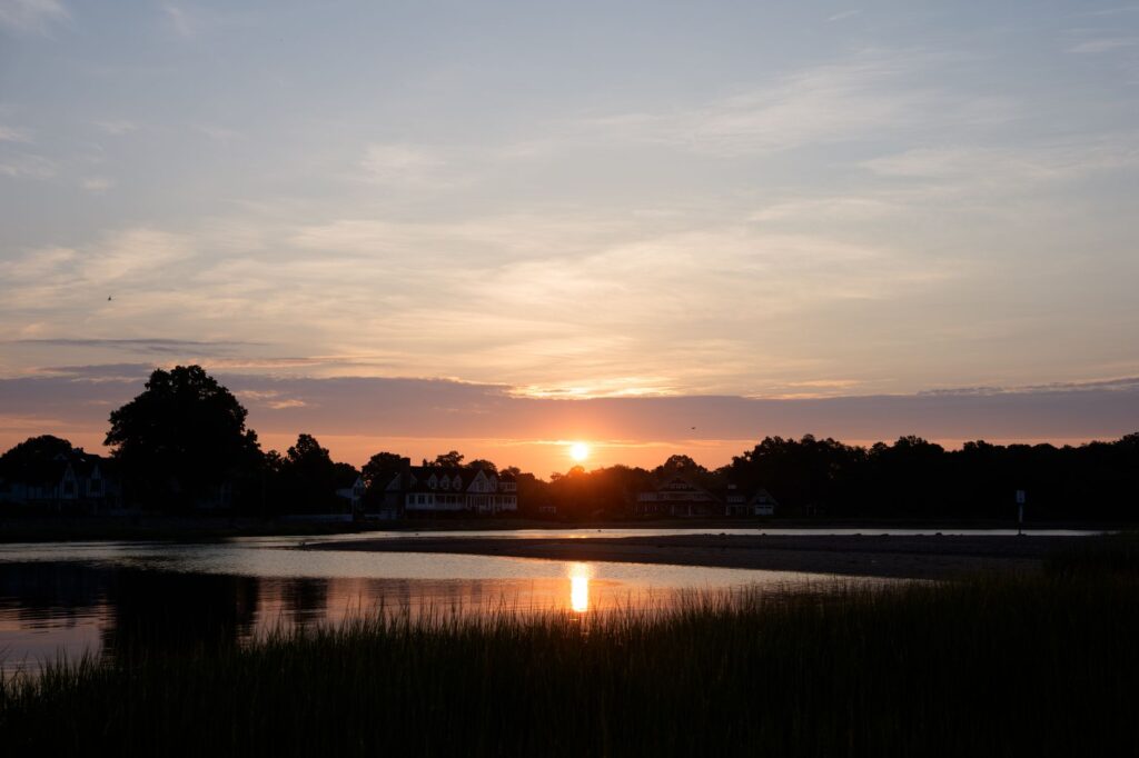 Stunning sunrise view over Cove Island Park in Stamford, Connecticut with calm waters and a serene sky.