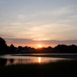 Stunning sunrise view over Cove Island Park in Stamford, Connecticut with calm waters and a serene sky.