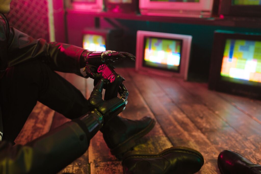 Futuristic cyberpunk vibe with a prosthetic hand holding a gaming joystick. Neon lights and retro TVs.