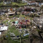 Aerial photo showing extensive hurricane damage in a residential area.
