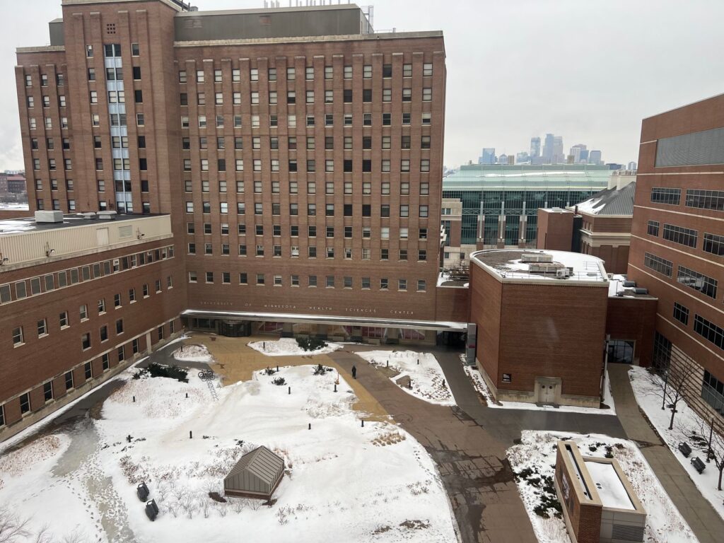 Snow-covered courtyard of University of Minnesota's Health Sciences Center in winter.