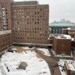 Snow-covered courtyard of University of Minnesota's Health Sciences Center in winter.