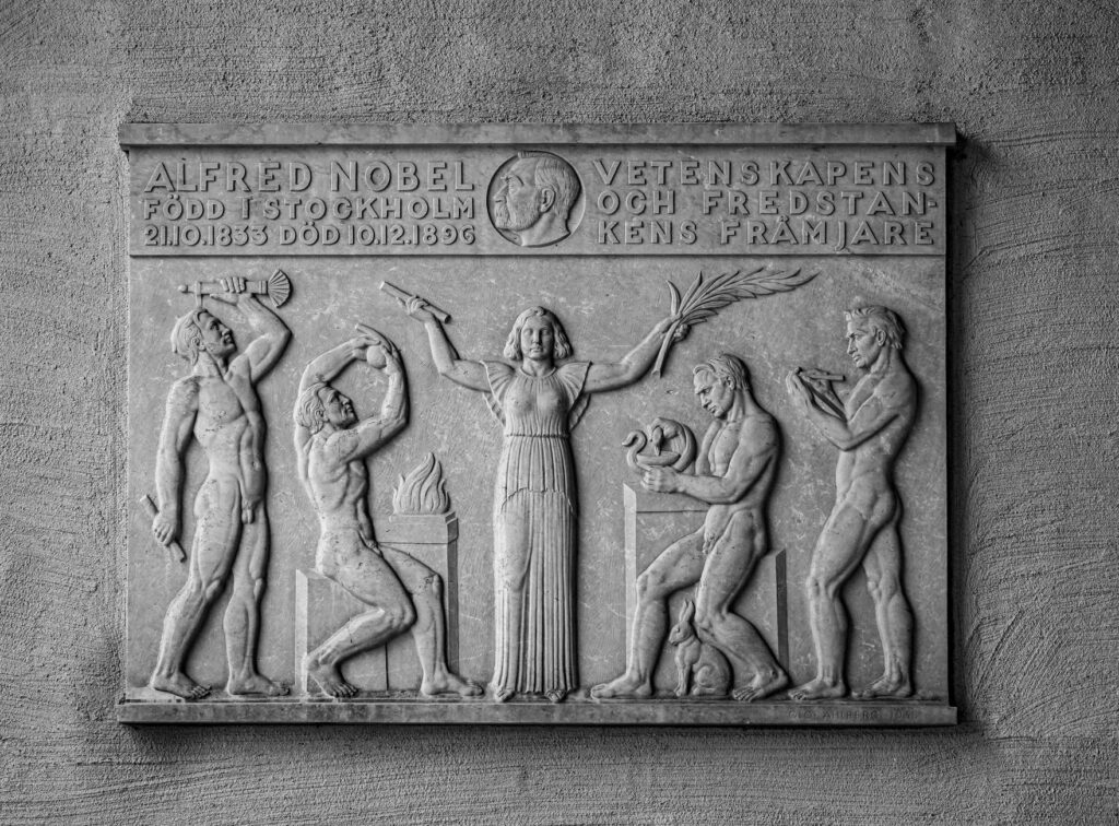 Black and white relief artwork honoring Alfred Nobel in Stockholm City Hall, Sweden.