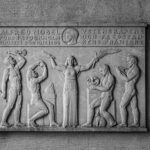 Black and white relief artwork honoring Alfred Nobel in Stockholm City Hall, Sweden.