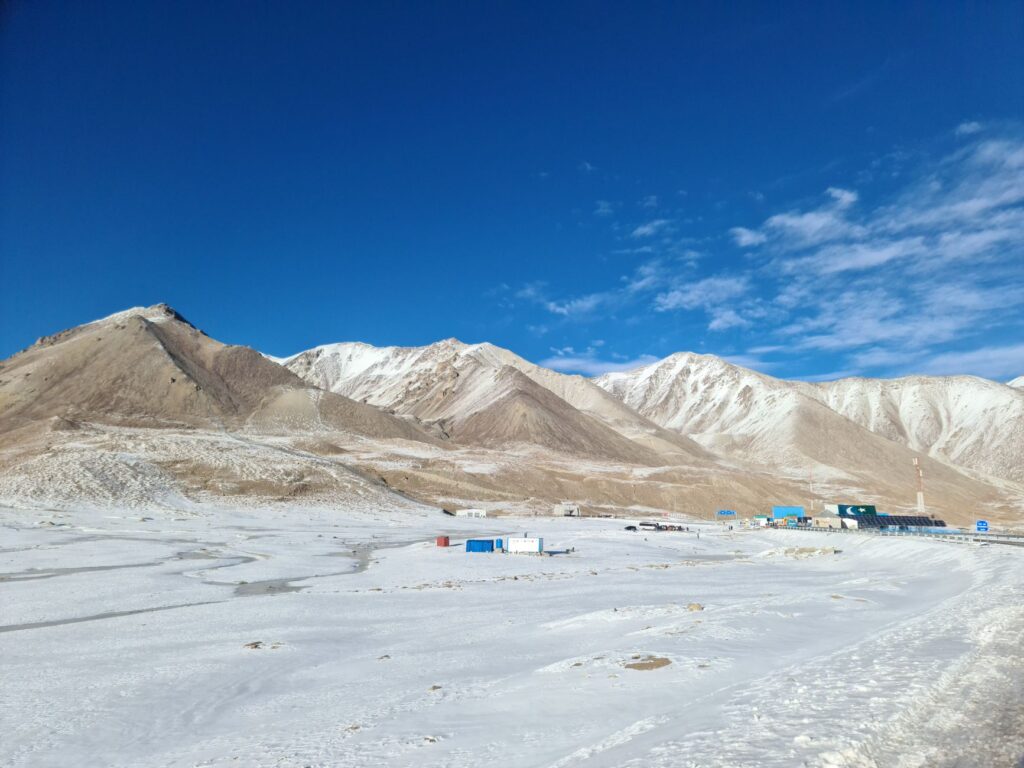 Panoramic view of snowy mountains at Khunjerab Pass on the China-Pakistan border.