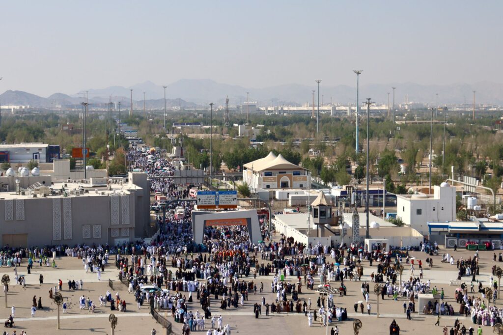 Aerial view of a large gathering at an outdoor marketplace in Mecca.