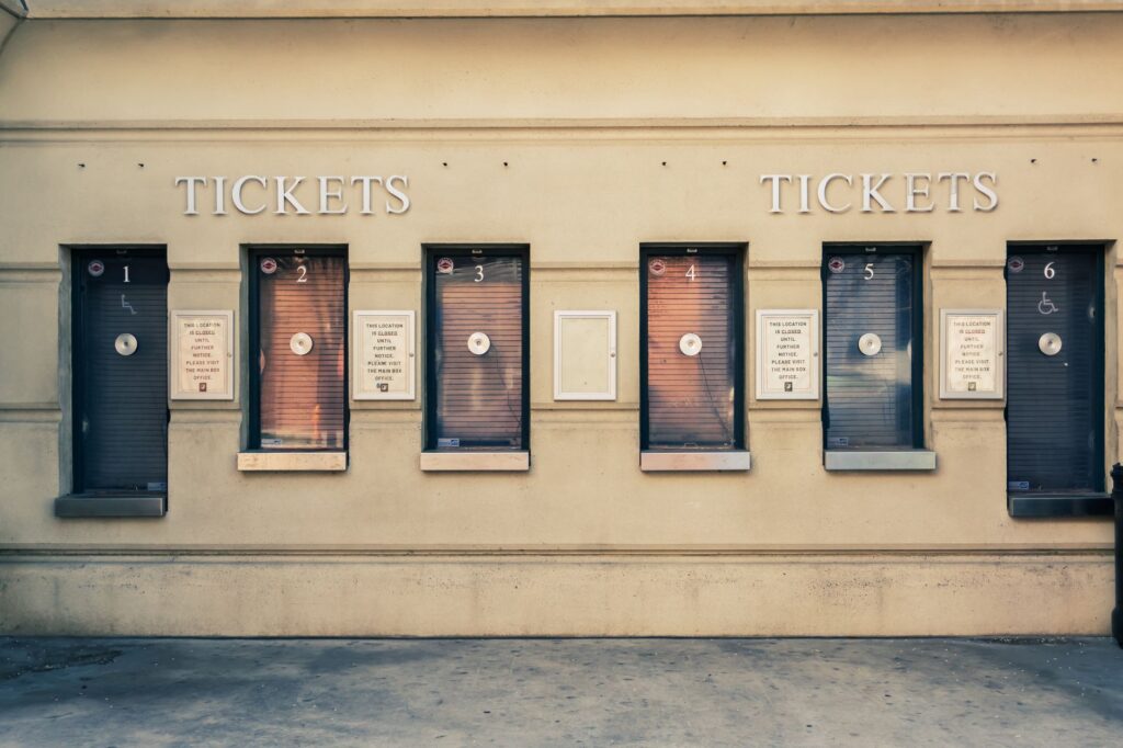Row of closed ticket booths in Baltimore city center, showcasing urban architecture.