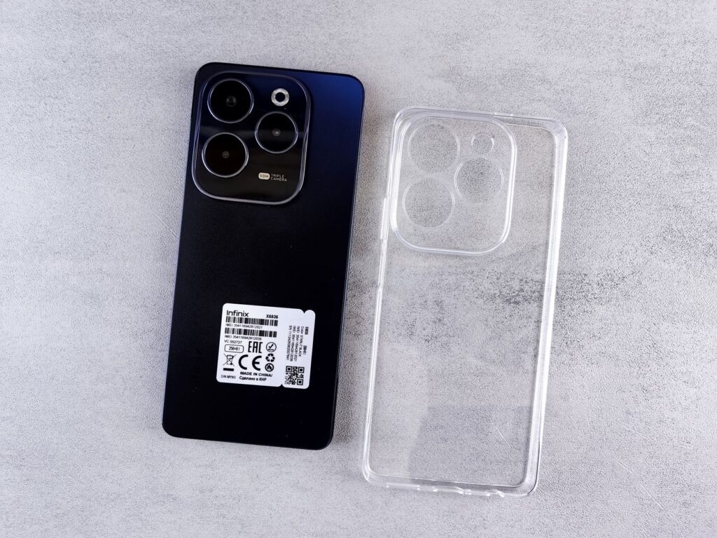Top view of Infinix Hot 40 Pro smartphone with transparent clear case on a light background.