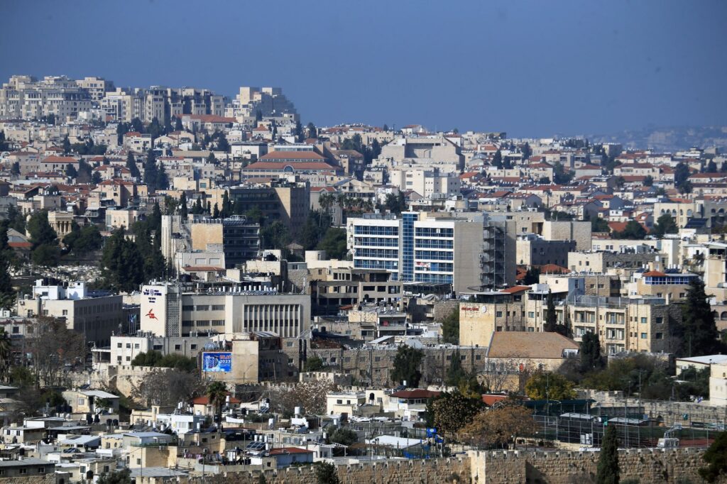 Explore the stunning skyline and urban architecture of Jerusalem from a high vantage point.