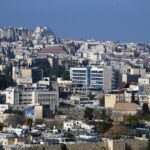 Explore the stunning skyline and urban architecture of Jerusalem from a high vantage point.