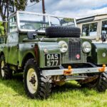 Vintage Land Rover Series vehicle parked outdoors, showcasing classic design.