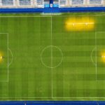 Top-down aerial view of a well-maintained football stadium.