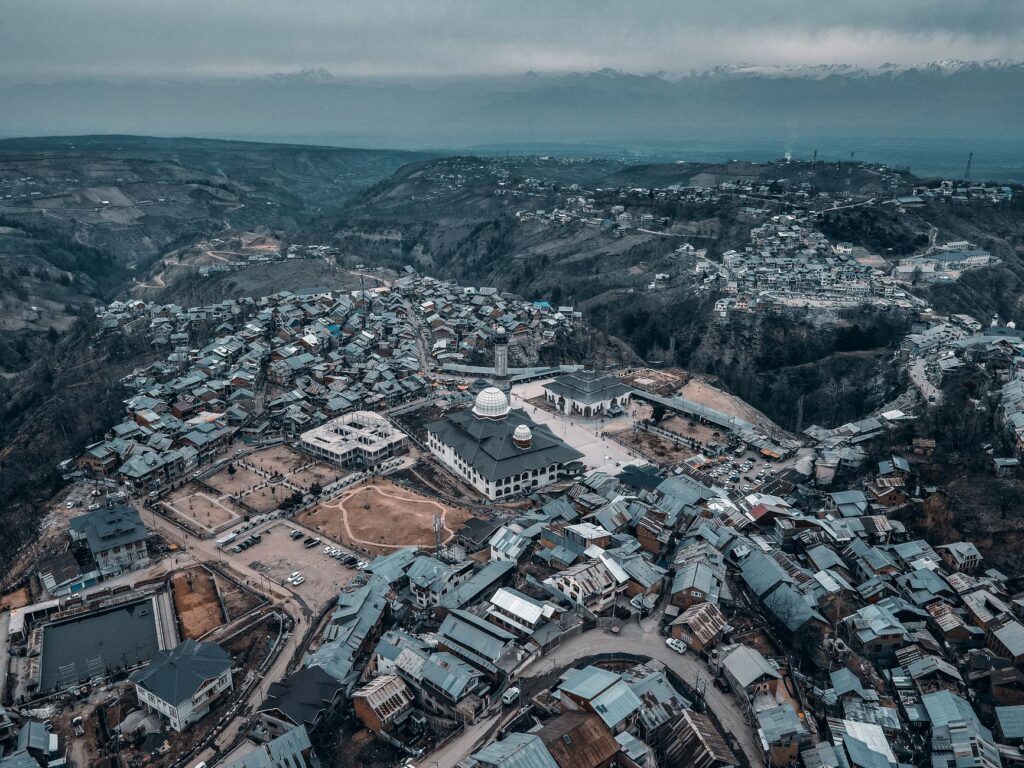 Stunning aerial view of Charar-i-Sharief in Kashmir, showcasing the town's unique landscape and architecture.