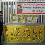 Peaceful protest in Vancouver advocating against the Islamic regime in Iran. Features banners and demonstrators.