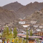 Charming hillside town of Leh in Ladakh, framed by majestic mountains. A unique blend of culture and nature.