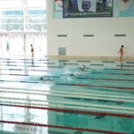 Kids participating in a swimming class at an indoor pool in Istanbul, Türkiye.