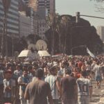 Lively street scene with football fans celebrating in Buenos Aires, Argentina.
