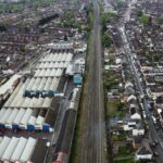 Aerial view of houses and train tracks in Maidenhall, illustrating urban and suburban architecture.