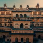Discover the historic beauty of Raja Mahal in Orchha Fort, India, showcasing ancient architecture.