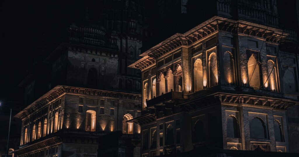 Night view of a beautifully illuminated historic building, showcasing stunning architectural details.