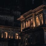 Night view of a beautifully illuminated historic building, showcasing stunning architectural details.