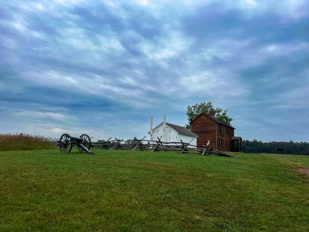 Scenic view of cannons and historic buildings at Manassas Battlefield Park.