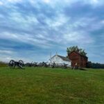 Scenic view of cannons and historic buildings at Manassas Battlefield Park.