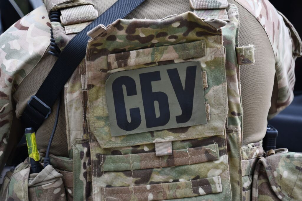 Close-up of a soldier wearing a camouflage vest with the Security Service of Ukraine insignia in Kyiv.