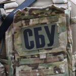 Close-up of a soldier wearing a camouflage vest with the Security Service of Ukraine insignia in Kyiv.